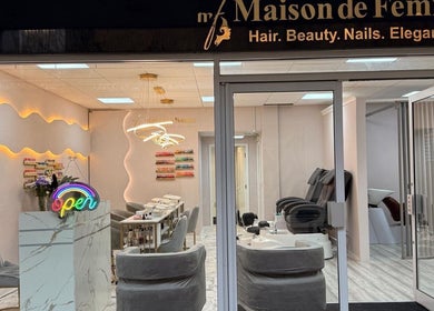 Elegant interior of Maison de Femme, Bristol, England showcasing beauty service stations and chic decor.
