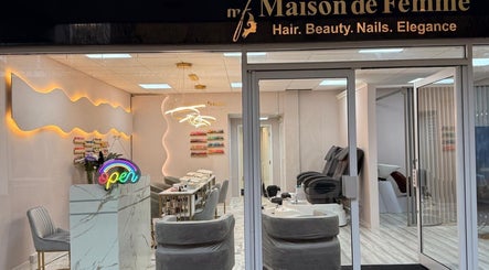 Elegant interior of Maison de Femme, Bristol, England showcasing beauty service stations and chic decor.