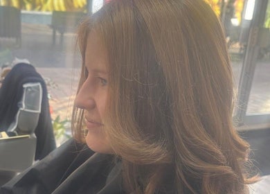 Profile view of styled hair at Maison De Femme, Bristol, England, GB, highlighting smooth hair design.