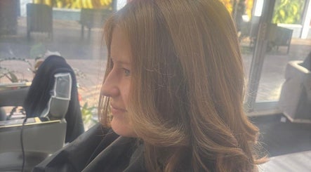 Profile view of styled hair at Maison De Femme, Bristol, England, GB, highlighting smooth hair design.