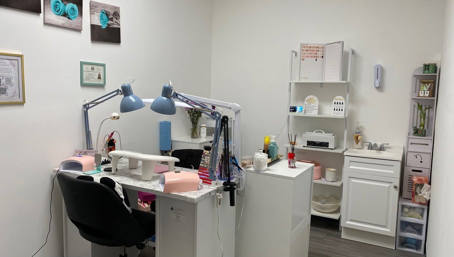 Cozy nail salon workspace at Nails by Bliss YN, Houston, Texas, US featuring manicure stations and decor.
