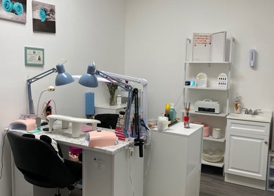 Cozy nail salon workspace at Nails by Bliss YN, Houston, Texas, US featuring manicure stations and decor.