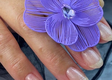 Elegant nails with a purple flower design at Nails by Bliss YN, Houston, Texas, US.