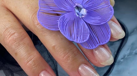 Elegant nails with a purple flower design at Nails by Bliss YN, Houston, Texas, US.