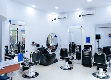 Modern barber chairs and mirrors at Umatura Barber Canggu, Bali, Bali, ID, offering stylish grooming services.