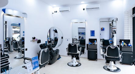 Modern interior of Umatura Barber Canggu in Bali, Bali, ID, featuring sleek barber chairs and mirrors.