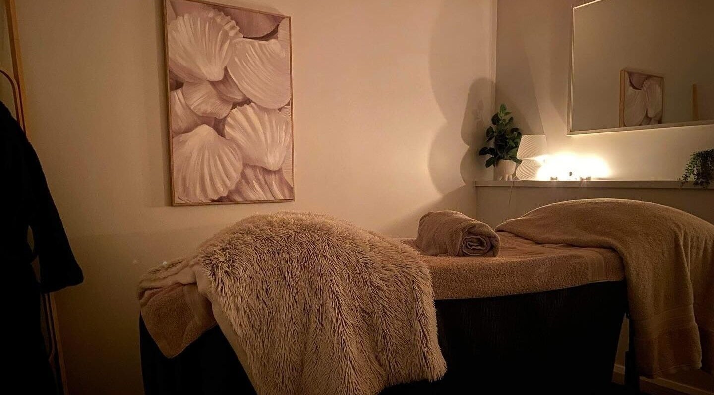 Cozy massage table at Beauty on Eighth, Mildura, Victoria, AU, set with soft lighting and plush blankets.