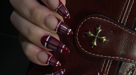 Elegant plaid nail art at Swaggie Nailz, Brick, US. Perfect manicure on a stylish leather bag.