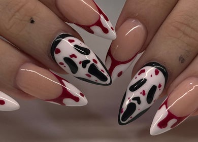 Creative nail art design at Swaggie Nailz in Brick Township, New Jersey, US showcasing red and black accents.