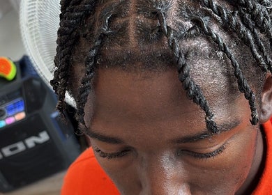 Intricate braided hairstyle at StyledByMarah, Bowling Green, Ohio, US salon, showcasing detailed craftsmanship.