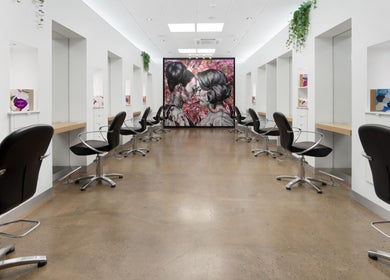 Interior of Helmet Hair Studio in Darwin City, Northern Territory, AU with modern styling chairs and decor.