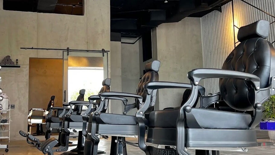 Modern barber chairs at FANE BARBERSHOP, Jeddah, Makkah Province, SA, showcasing upscale interior.