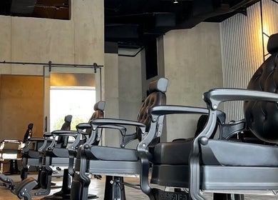Modern barber chairs at FANE BARBERSHOP, Jeddah, Makkah Province, SA, showcasing upscale interior.