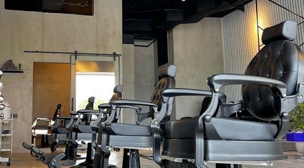 Modern barber chairs at FANE BARBERSHOP, Jeddah, Makkah Province, SA, showcasing upscale interior.