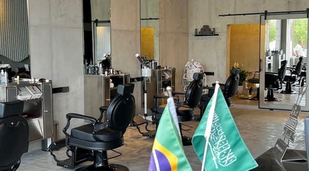 Modern interior of FANE BARBERSHOP in Jeddah, Makkah Province, SA with stylish chairs and decor.