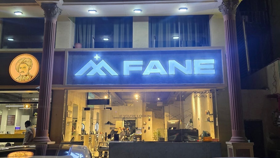 Front view of Fane Barbershop in Jeddah, Makkah Province, SA with illuminated signage.