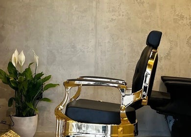 Elegant barber chair at Fane Barbershop, Jeddah, Makkah Province, SA, enhancing the refined ambiance.