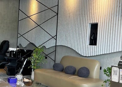 Stylish waiting area at Fane Barbershop, Jeddah, Makkah Province, SA, with sleek decor and comfortable seating.