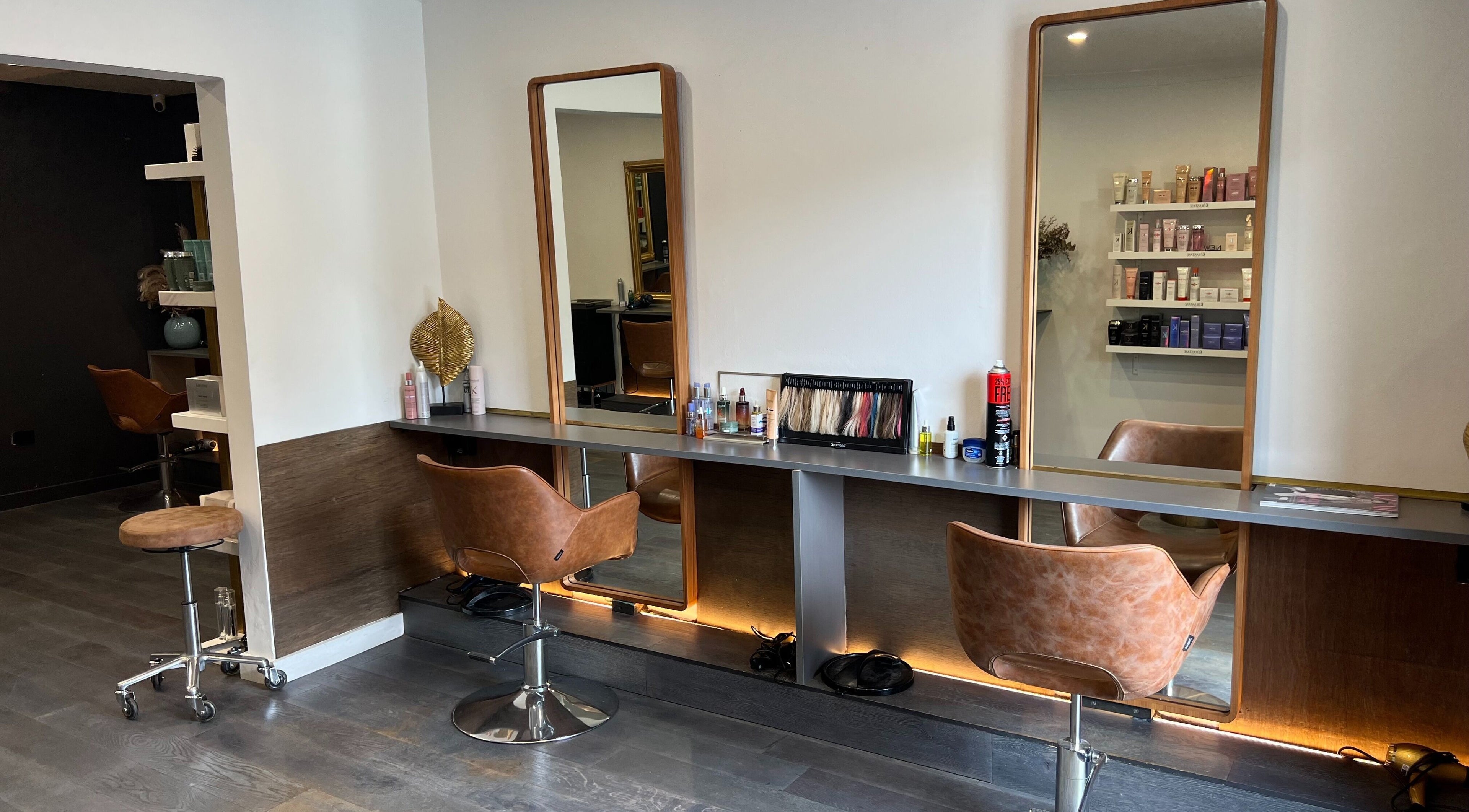 Volkan Coban Hair salon interior in Leichhardt, New South Wales, AU, showcasing stylish chairs and mirrors.