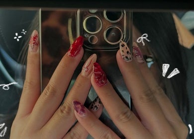 Creative nail art from claw’d studios, Singapore, Singapore, SG displayed on elegantly manicured hands.