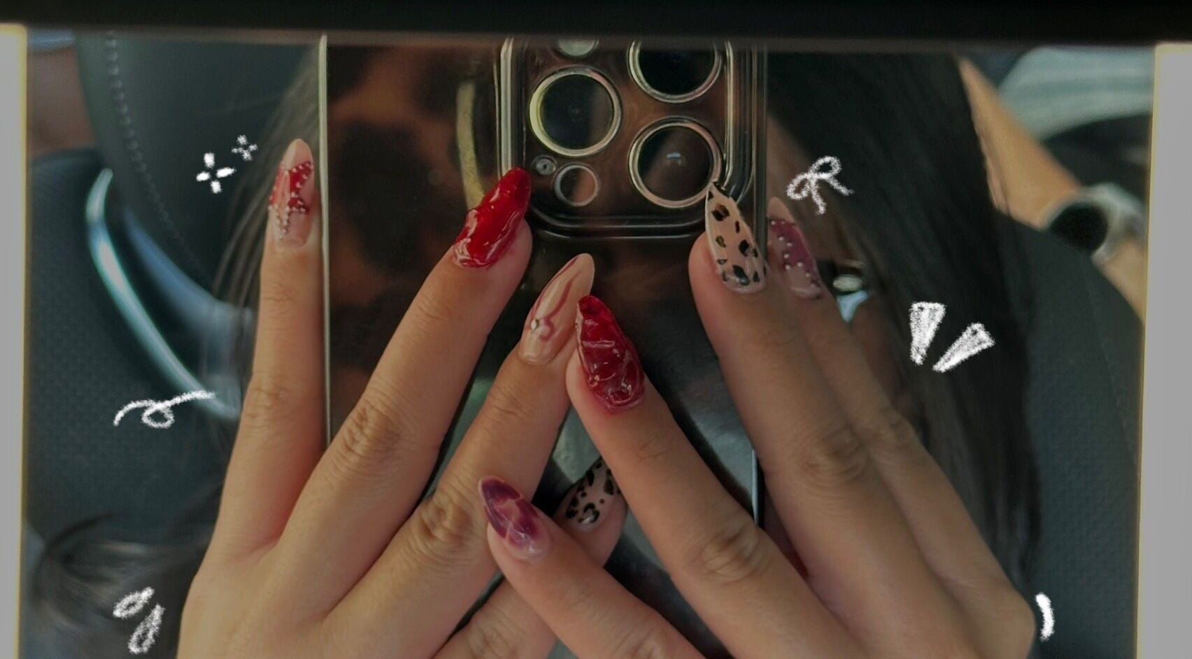 Creative nail art from claw’d studios, Singapore, Singapore, SG displayed on elegantly manicured hands.