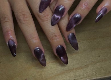 Elegant violet nail art at claw’d studios, Singapore, SG showcasing a trendy pointed finish.