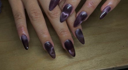 Elegant violet nail art at claw’d studios, Singapore, SG showcasing a trendy pointed finish.