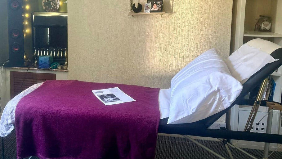 Comfortable massage bed at Eternal Flame Holistic Wellbeing, Blaenavon, Wales, GB, ready for a relaxing session.
