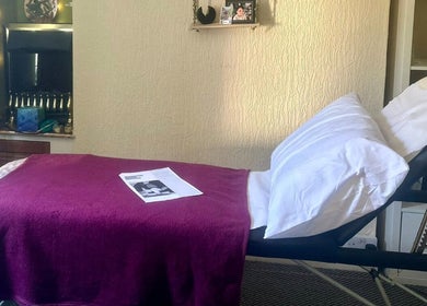 Comfortable massage bed at Eternal Flame Holistic Wellbeing, Blaenavon, Wales, GB, ready for a relaxing session.