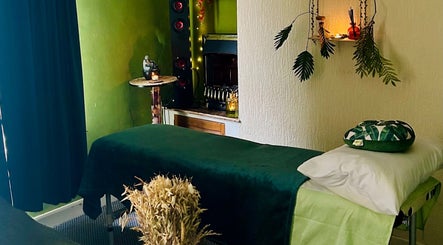 Tranquil massage room at Eternal Flame Holistic Wellbeing in Blaenavon, Wales, GB with soothing decor.