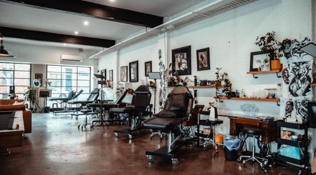 Interior of Umbra Tattoo, a stylish studio in Melbourne, Victoria, AU with modern tattoo stations and art decor.