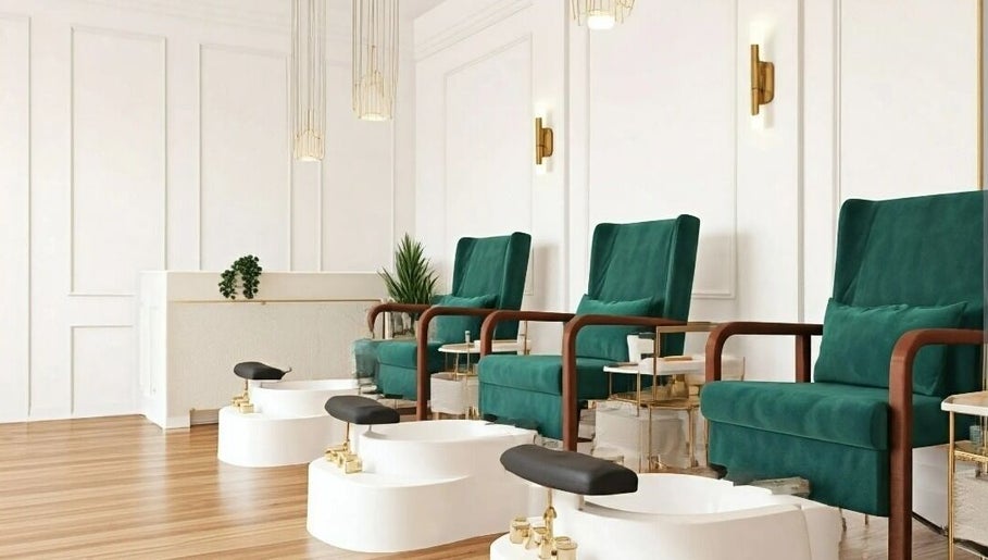 Spacious nail salon at Your Muse, Beirut, Beirut Governorate, LB with plush green chairs and foot baths.
