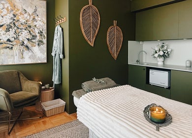 Tranquil massage room at Eden Massage Studio, East Perth, Western Australia, with cozy chair and ambient lighting.