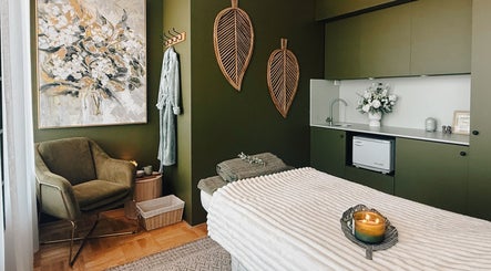 Tranquil massage room at Eden Massage Studio, East Perth, Western Australia, with cozy chair and ambient lighting.