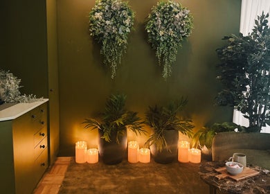 Calming green interior with plants and candles at Eden Massage Studio, East Perth, Western Australia, AU.