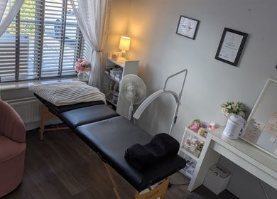 Relaxing treatment room at The Lash Retreat, Golborne, England, GB with cozy decor and therapy bed.