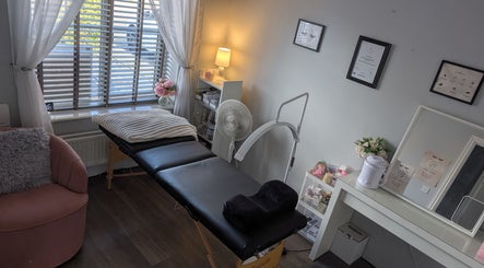 Relaxing treatment room at The Lash Retreat, Golborne, England, GB with cozy decor and therapy bed.