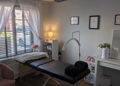 Tranquil treatment room at The Lash Retreat in Golborne, England, GB, with elegant decor and massage bed.