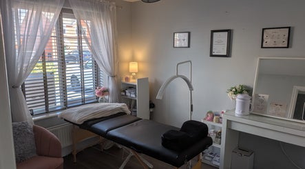 Tranquil treatment room at The Lash Retreat in Golborne, England, GB, with elegant decor and massage bed.