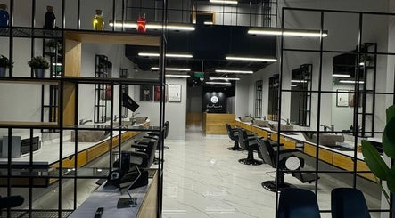 Sleek interior of Yousef Afandi - Hittin Branch in Riyadh, Riyadh Province, SA with stylish salon chairs and decor.