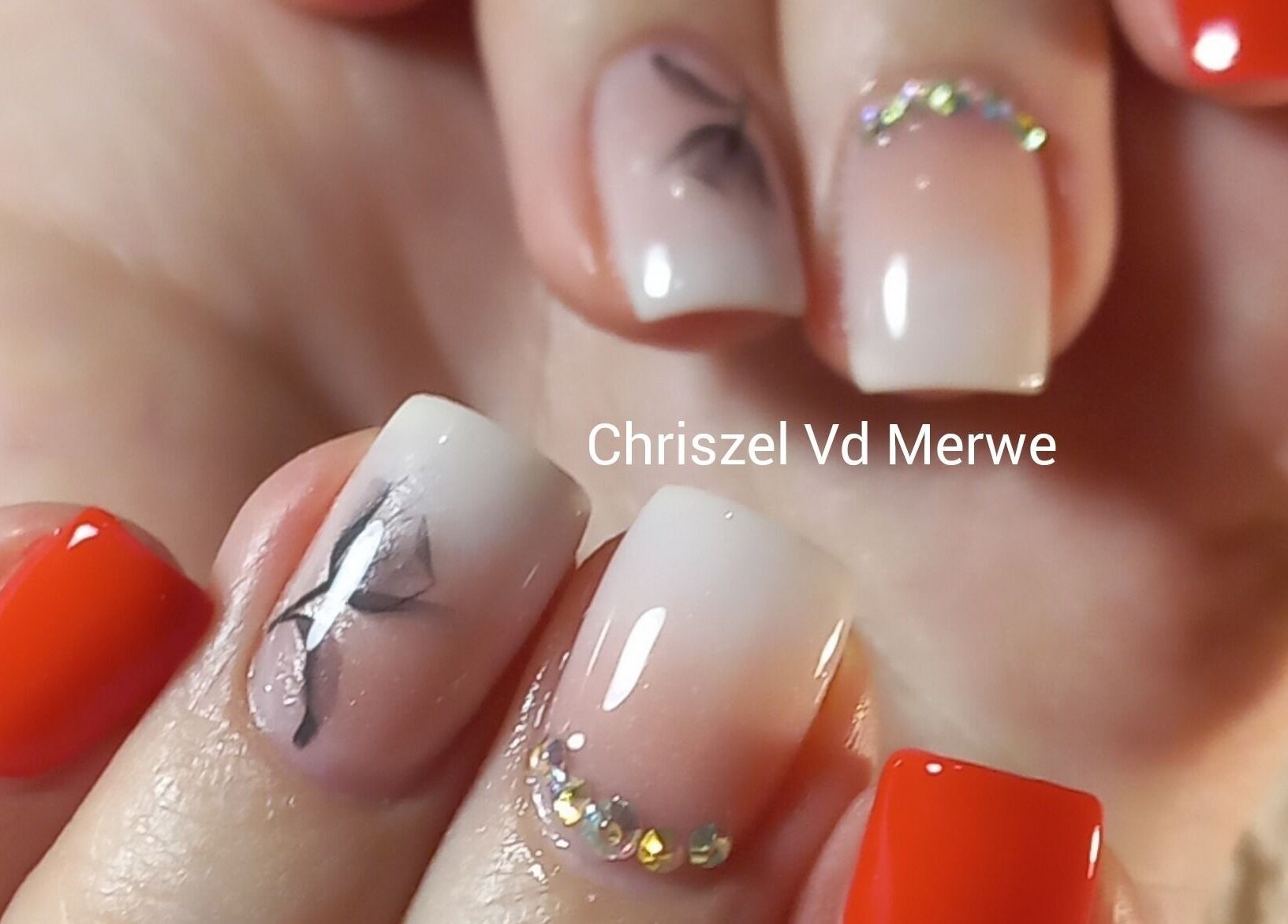 Elegant nail art with red polish and crystal accents at Blush Beauty, Middelburg, Mpumalanga, ZA.