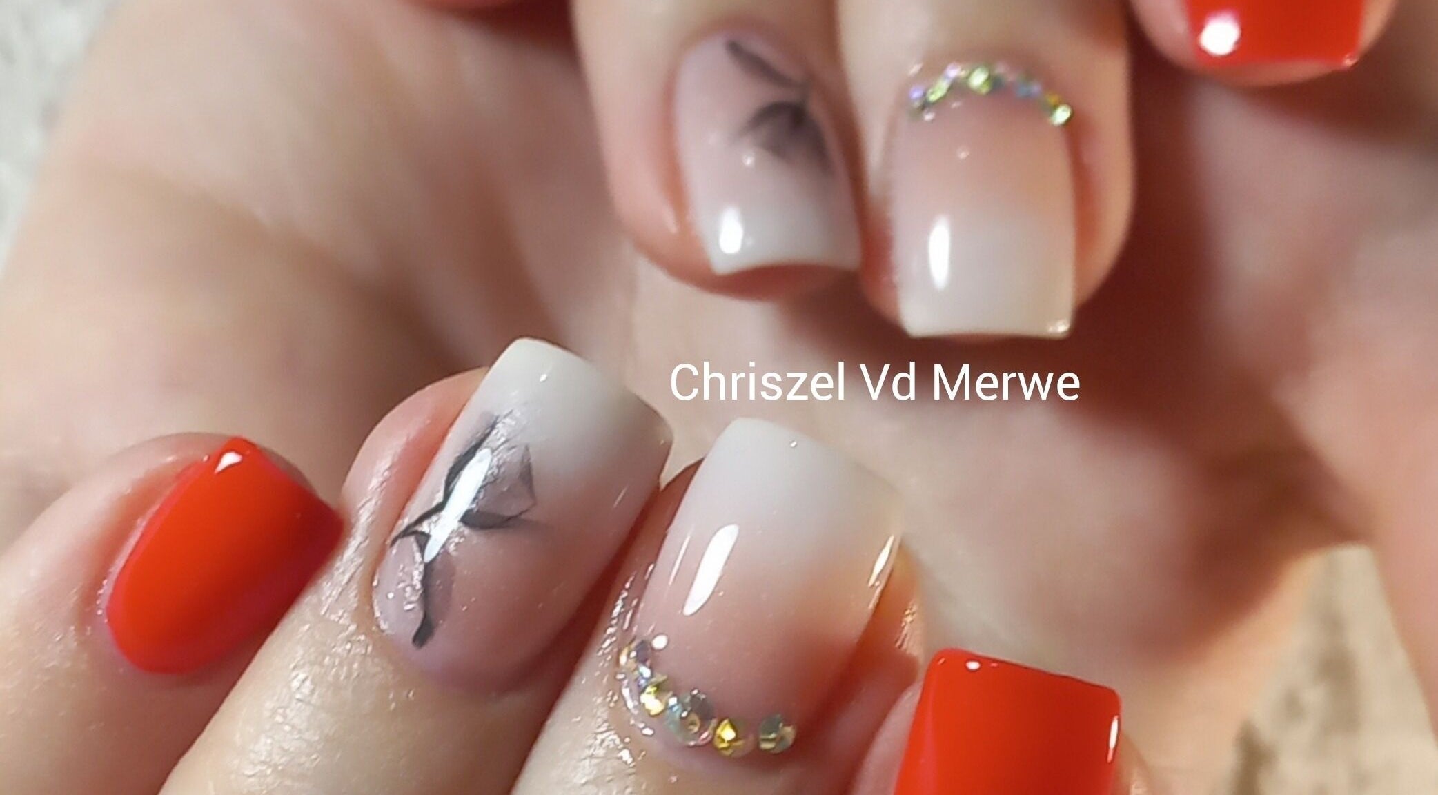 Elegant nail art with red polish and crystal accents at Blush Beauty, Middelburg, Mpumalanga, ZA.