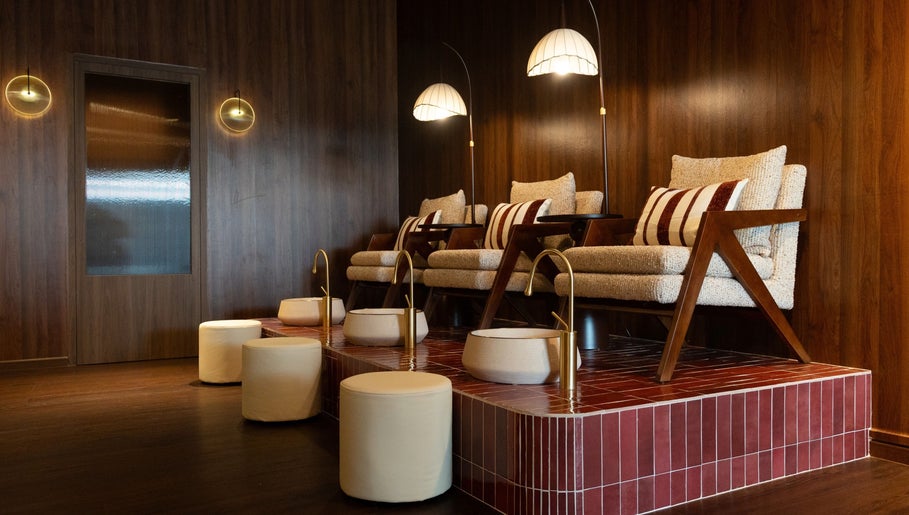 Luxurious seating at Cupid's Club, Singapore, SG with plush chairs and warm lighting.