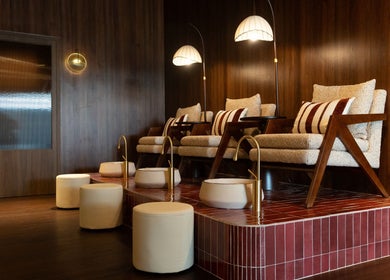 Luxurious seating at Cupid's Club, Singapore, SG with plush chairs and warm lighting.