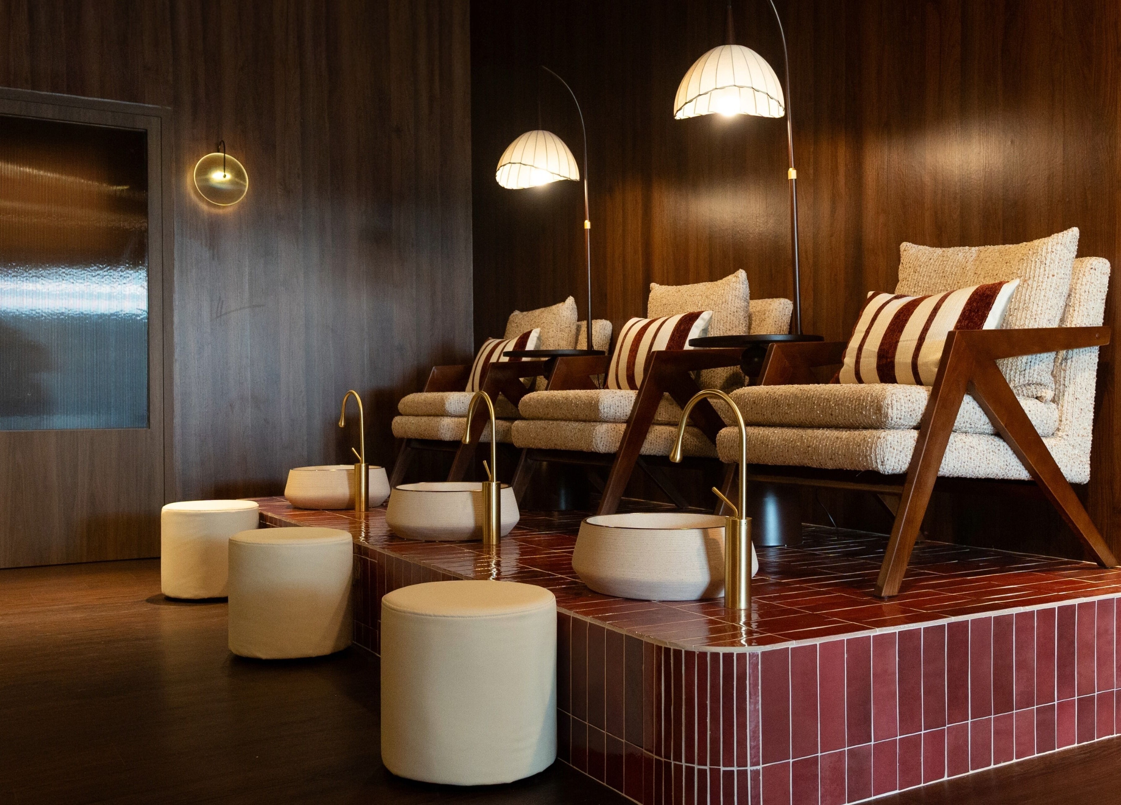 Luxurious seating at Cupid's Club, Singapore, SG with plush chairs and warm lighting.