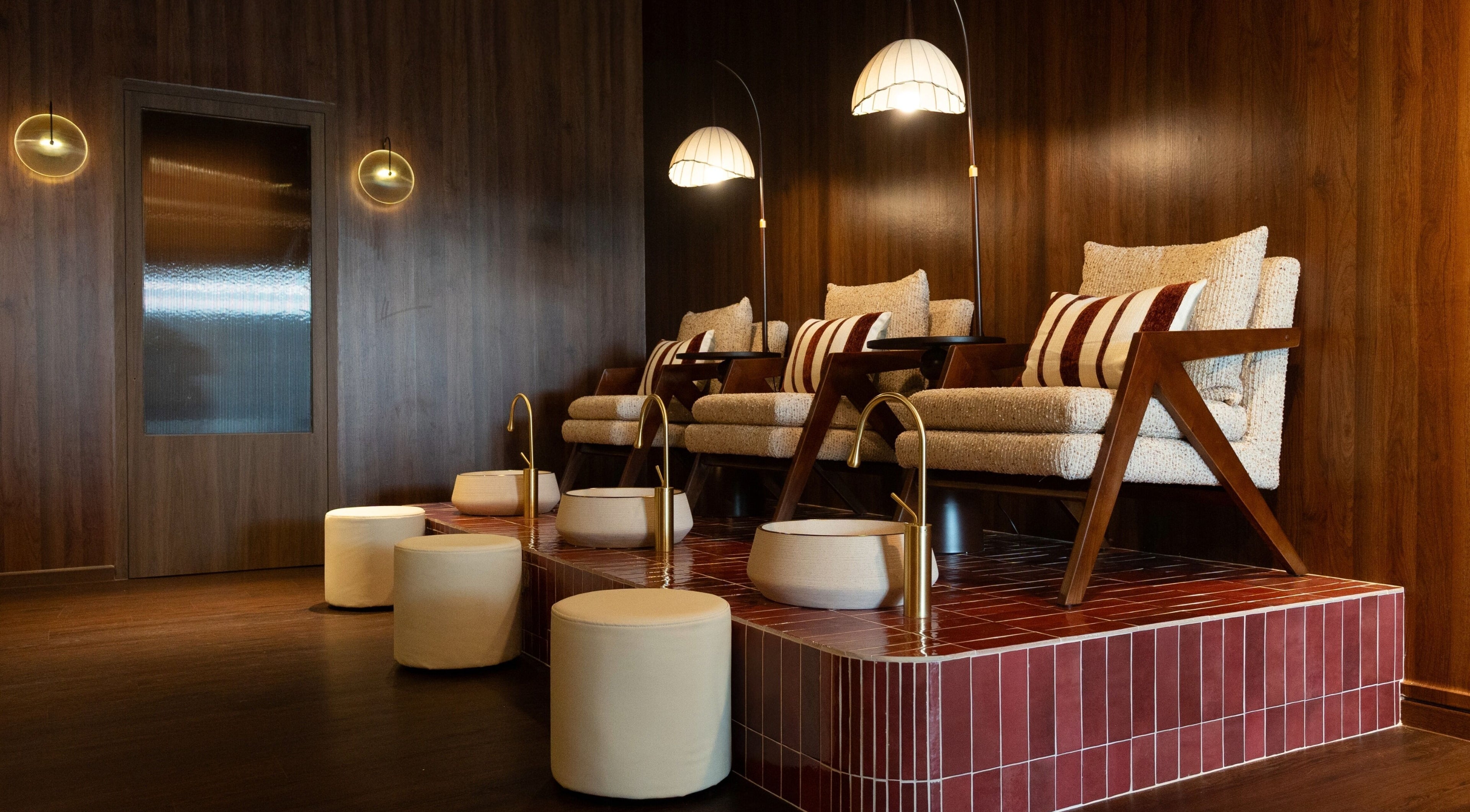 Luxurious seating at Cupid's Club, Singapore, SG with plush chairs and warm lighting.