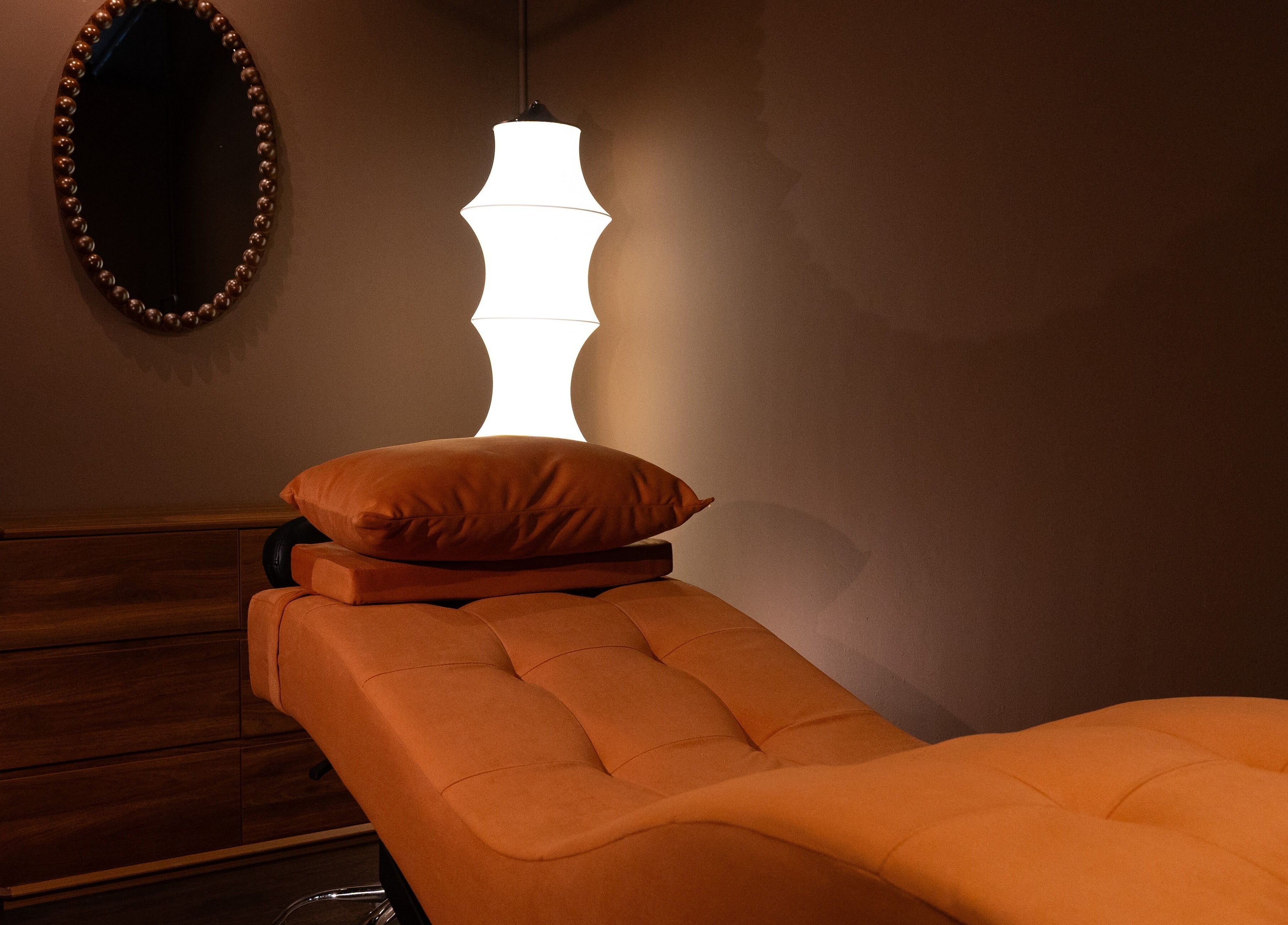 Relaxation room with cozy ambiance at Cupid's Club, Singapore, SG, featuring a plush massage table and soft lighting.