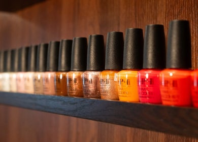 Colorful nail polish display at Cupid's Club, Singapore, SG, showcasing a range of vibrant shades.
