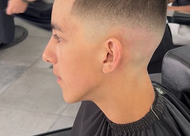 Close-up of a precision fade hairstyle at MaxLewisHair in Ware, England, GB.