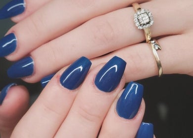 Elegant blue manicured nails at Natures Embrace Spa, Madawaska, Ontario, CA.
